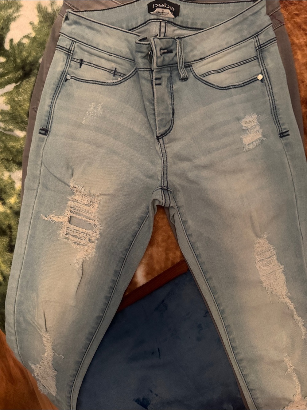 bebe Light Wash Distressed Skinny Jeans